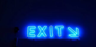 Kentucky Sees Quiet Sweepstakes Casino Exits as 30+ Platforms Pull Back Blue neon “Exit” sign with an arrow pointing right against a dark background