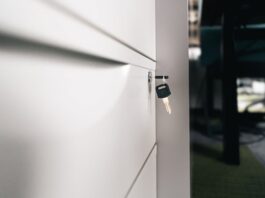 Light & Wonder Challenges Court Order on Privileged Materials in Aristocrat Trade-Secrets Case Close-up of a locked office drawer with a key hanging from the lock