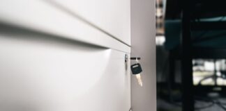 Light & Wonder Challenges Court Order on Privileged Materials in Aristocrat Trade-Secrets Case Close-up of a locked office drawer with a key hanging from the lock