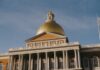 Massachusetts Moves to Require Sportsbooks to Inform Bettors When — and Why — They are Limited The Massachusetts State House in Boston, featuring its gold dome and columned facade under a clear sky