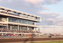 New York’s Casino Expansion Reignites Northern New Jersey’s Racino Push Crowds gathered in the grandstand at the Meadowlands Racetrack during a live racing event at sunset.