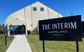 Norfolk Temporary Casino Posts Modest Early Revenue Sign outside the Interim Gaming Hall temporary casino in Norfolk, Virginia, showing the entrance to the slot-only gaming facility.