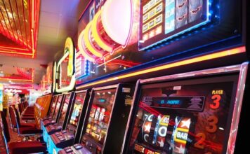 Northern New Jersey Casino Push Intensifies After NYC Approvals Slot machines lined up inside a casino gaming floor with illuminated displays