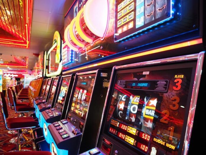 Northern New Jersey Casino Push Intensifies After NYC Approvals Slot machines lined up inside a casino gaming floor with illuminated displays