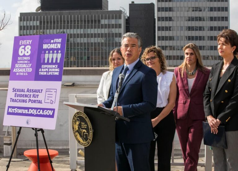 California Attorney General Rob Bonta speaks at a press conference with advocates standing behind him