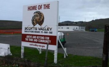 When Four Tribes Go to War: Scotts Valley Fights for Vallejo Casino Sign marking land belonging to the Scotts Valley Band of Pomo Indians, with modular buildings in the background