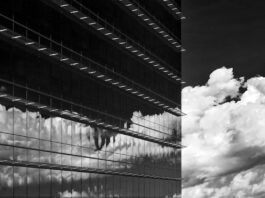 Fairfax Board Opposes Casino Unless Requested — A Deepening Blow to Tysons Plan Glass office tower with clouds reflected in the windows