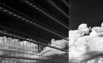 Fairfax Board Opposes Casino Unless Requested — A Deepening Blow to Tysons Plan Glass office tower with clouds reflected in the windows