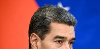 Polymarket Faces Backlash After Saying Venezuela Wasn’t Invaded Venezuelan President Nicolás Maduro speaking during a formal meeting, wearing a dark suit and patterned tie.