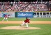 Update on MLB Betting Scandal: Clase Accused of Rigging Pitches in Playoffs & New Accomplice Named A Cleveland Guardians pitcher delivers a pitch from the mound during a daytime MLB game with a full crowd in the stands.