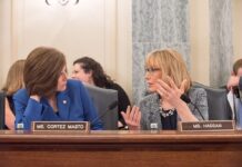 U.S. Sen. Catherine Cortez Masto speaks with Sen. Maggie Hassan during a Senate committee hearing in Washington, D.C.