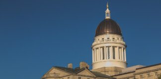 Maine Gambling Board Seeks Veto of iGaming Bill, Poll Shows Public Opposition to Online Casinos Autumn sunset view of the Maine State Legislature building in Augusta, Maine.