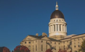 Autumn sunset view of the Maine State Legislature building in Augusta, Maine.