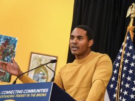 Rep. Ritchie Torres speaks at a podium during a Penn Access project event, with a U.S. flag visible behind him.