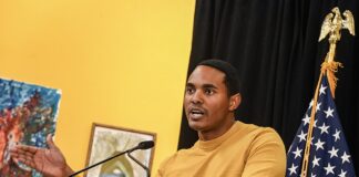 Rep. Torres Introduces Bill Barring Federal Officials From Insider Trading on Prediction Markets Rep. Ritchie Torres speaks at a podium during a Penn Access project event, with a U.S. flag visible behind him.