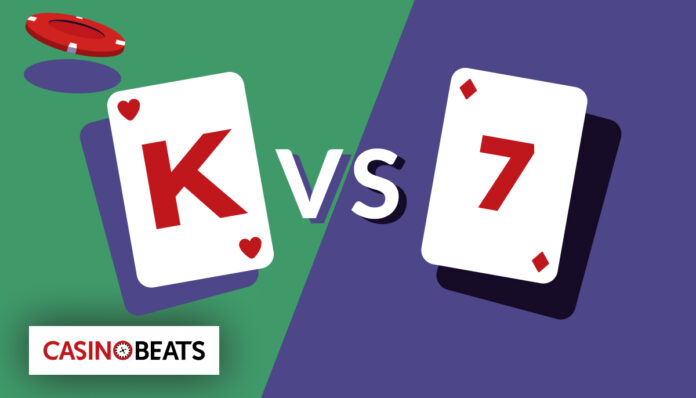 a King (K) playing card versus a 7 card, with poker chips in the background. It visually represents a head-to-head card battle typical of the Casino War game.