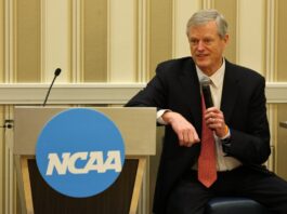NCAA Asks CFTC to Hit Pause on College Sports Prediction Markets Until Rules Catch Up NCAA President Charlie Baker speaks into a microphone while seated beside an NCAA-branded podium at a conference event.