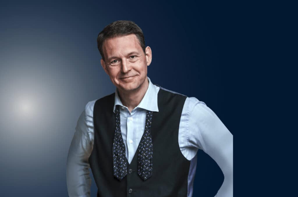 Declan Hill, a match-fixing expert, stands during a public speaking engagement.