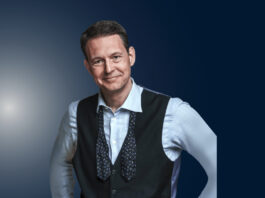 Declan Hill, a match-fixing expert, stands during a public speaking engagement.