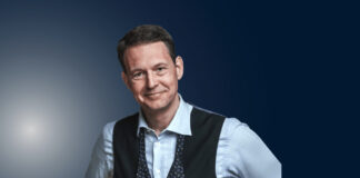 Declan Hill, a match-fixing expert, stands during a public speaking engagement.