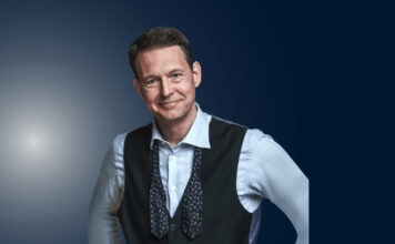 Declan Hill, a match-fixing expert, stands during a public speaking engagement.