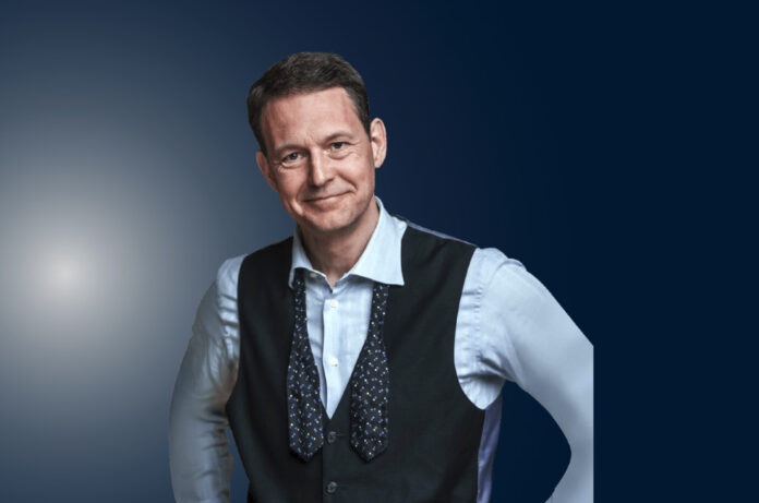 Declan Hill, a match-fixing expert, stands during a public speaking engagement.