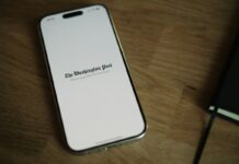 Coalition for Prediction Markets Responds to Insider Trading Debate With Full-Page Ad in Washington Post A smartphone displaying The Washington Post logo on a wooden surface