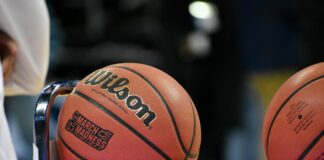 NCAA Renews Call for States to Eliminate College Prop Bets After Point-Shaving Indictments College basketballs resting on a rack courtside during a game