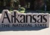 FanDuel, DraftKings File Applications to Enter Arkansas Sports Betting Market Stone sign reading “Arkansas The Natural State” outside a public building