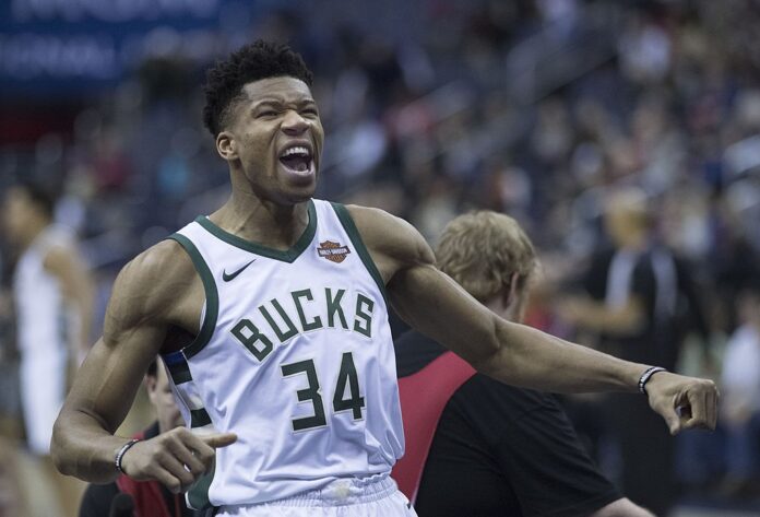 Giannis Antetokounmpo celebrates during a Milwaukee Bucks game.