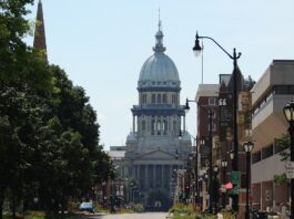 Illinois Targets Prediction Markets With New Oracle Act Legislation Illinois State Capitol building in Springfield viewed from a city street
