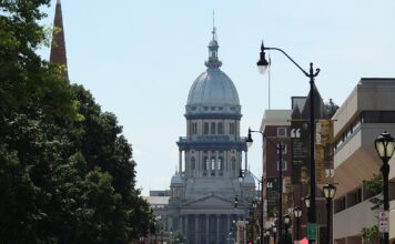 Illinois Targets Prediction Markets With New Oracle Act Legislation Illinois State Capitol building in Springfield viewed from a city street