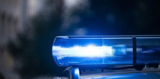 Man Found Naked At West Virginia Casino Allegedly Shot and Killed Father Hours Earlier Blue police light bar flashing.