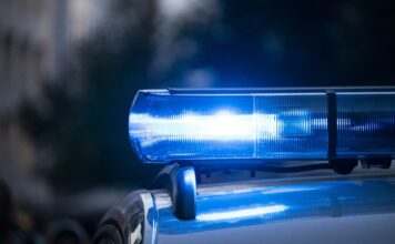 Man Found Naked At West Virginia Casino Allegedly Shot and Killed Father Hours Earlier Blue police light bar flashing.