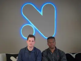 Novig Secures $75M as It Eyes Entry Into Sports Prediction Markets Novig founders seated on a couch beneath the company’s illuminated logo at the firm’s headquarters.