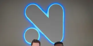 Novig Secures $75M as It Eyes Entry Into Sports Prediction Markets Novig founders seated on a couch beneath the company’s illuminated logo at the firm’s headquarters.