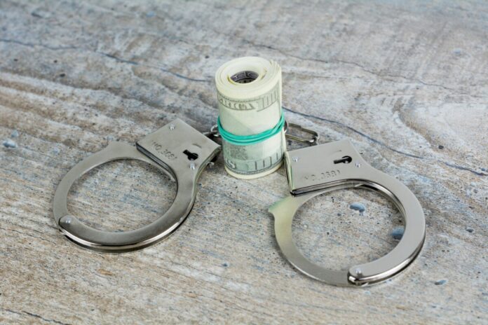 Handcuffs and cash