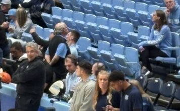 Caleb Wilson with hand in a cast