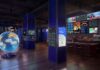 Polymarket Heads to D.C. With ‘Situation Room’ Pop-Up at Proper 21 Rendering of The Situation Room by Polymarket pop-up bar featuring screens with live data, news feeds, and market dashboards
