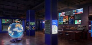 Rendering of The Situation Room by Polymarket pop-up bar featuring screens with live data, news feeds, and market dashboards