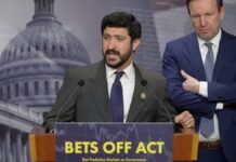 Rep. Greg Casar speaks at a podium during a press conference on the BETS OFF Act as Sen. Chris Murphy stands beside him.