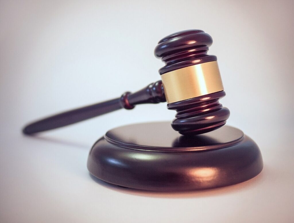 Judge’s gavel on a wooden block symbolizing a court ruling
