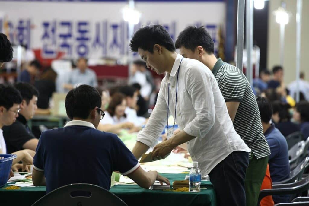 Officials count vote slips during a South Korean election.