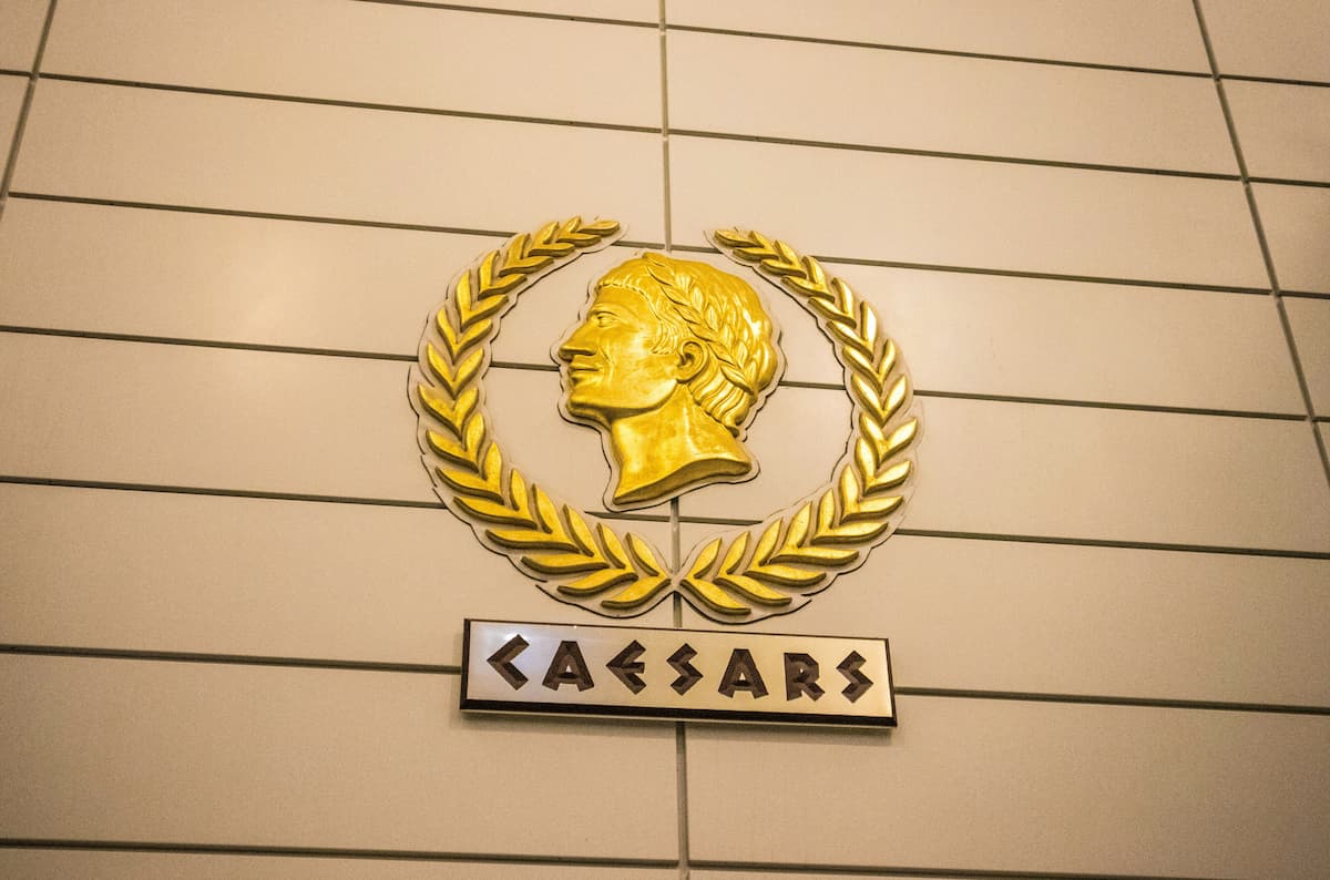The Caesars Entertainment logo on a wall.
