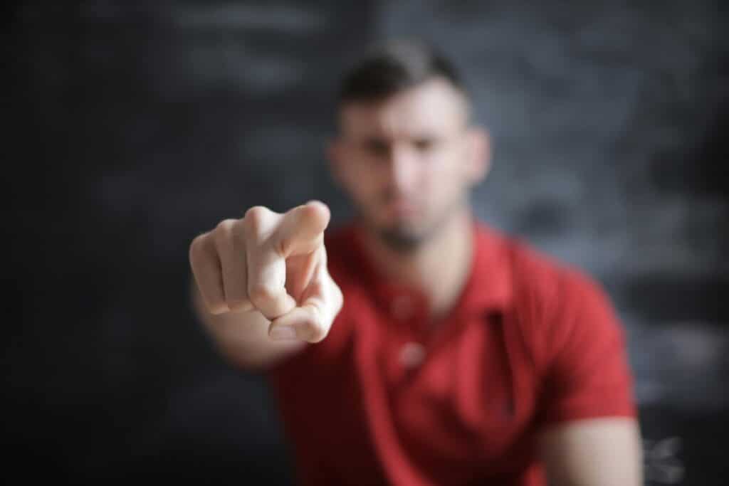 A man pointing his finger at the camera.