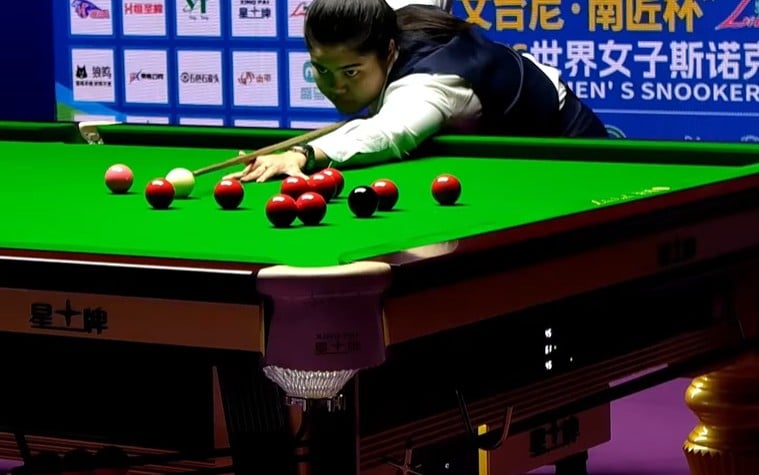 Young Thai snooker star Panchaya Channoi, also known as “Mind Sakol,” aims to pot a red during the final of the Women’s World Championship in Dongguan, China.